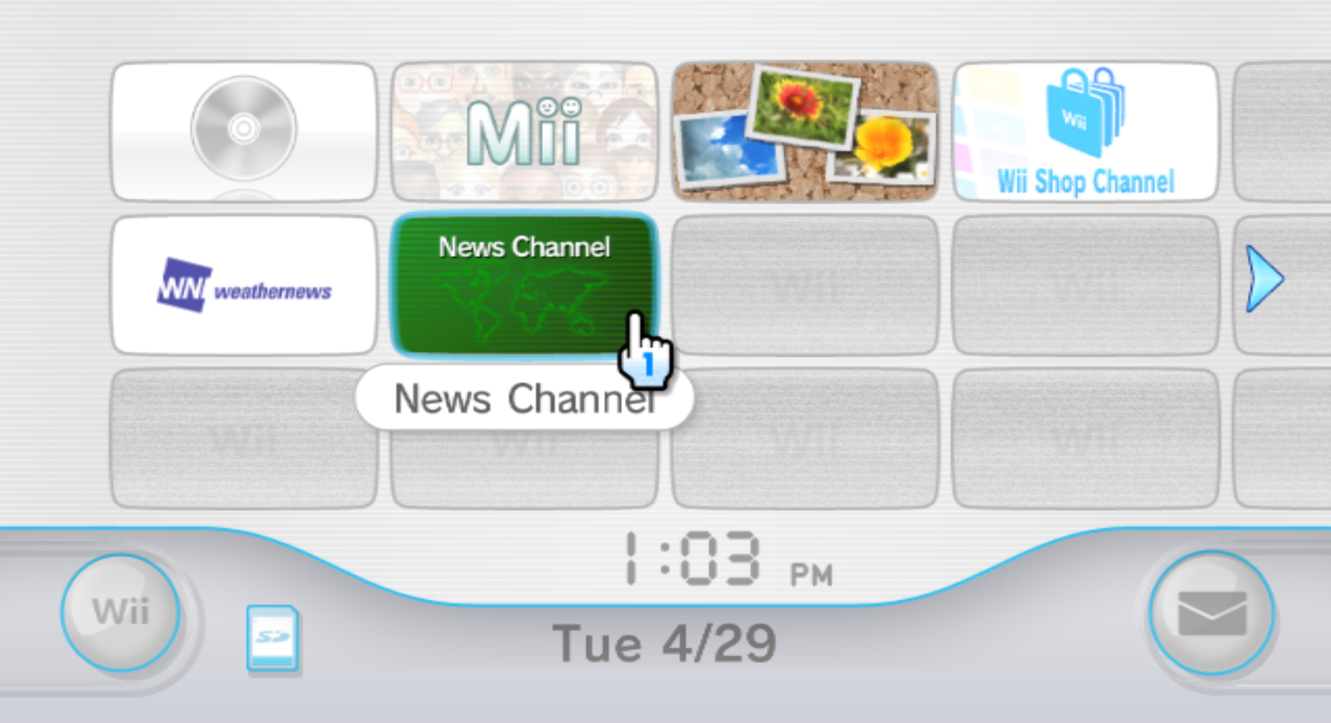 A screenshot of the Wii's system menu. Shows all the default channels in a 4x3 grid layout akin to TV channels. There is a blue Player 1 cursor shown on screen from the Wii Remote. Below the channels has the system date and time, with a settings button, SD card menu, and the Wii Message Board.